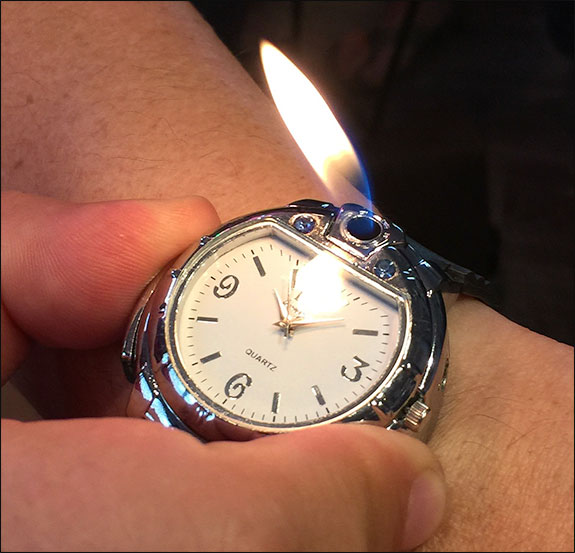 Wristwatch cigar lighter.